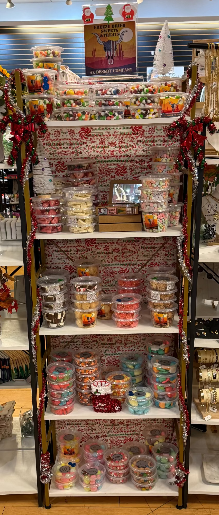 Display rack with various freeze dried snack containers and products in a store setting