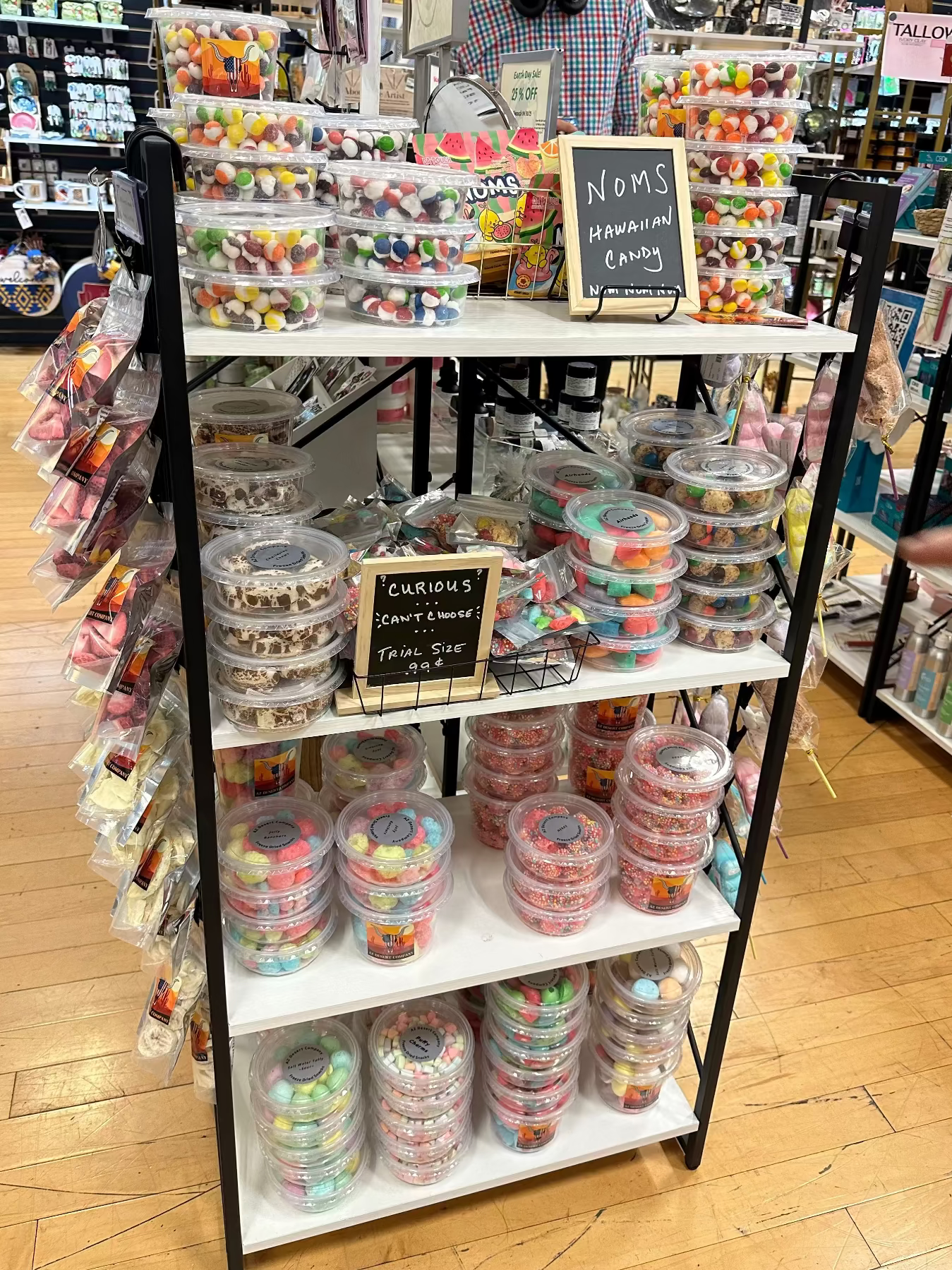 Display of freeze dried candy in a store with a person in the background