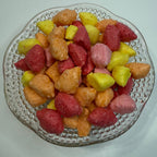 Freeze Dried Starbursts on a decorative glass plate with a white background