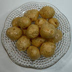 Glass plate with freeze dried caramels on a white background