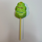 Freeze dried christmas tree peep on a stick with a white background