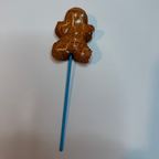 Freeze dried gingerbread man peep on a stick against a white background