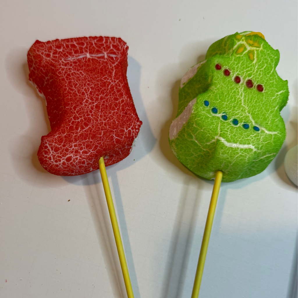 Freeze dried stocking & tree peeps on sticks against a white background