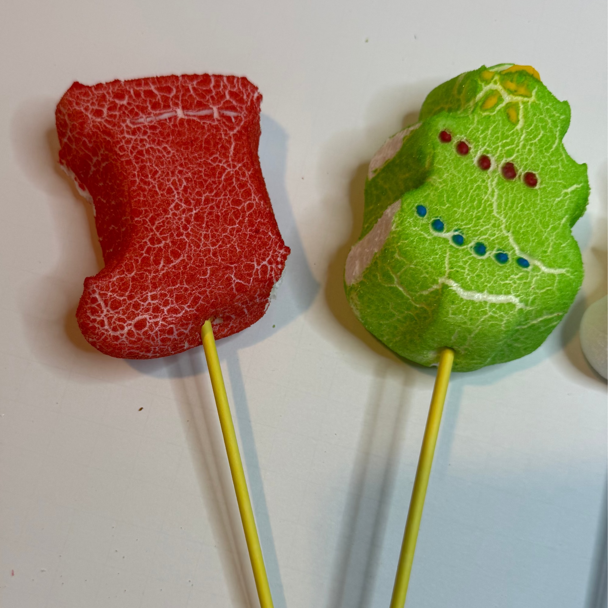 Freeze dried stocking & tree peeps on sticks against a white background