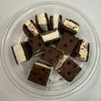 Freeze dried ice cream sandwich bites in a clear container on a white background