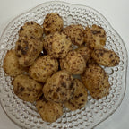 Glass plate with freeze dried milk dudz on a white background