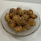 Glass plate with freeze dried milk dudz on a white background