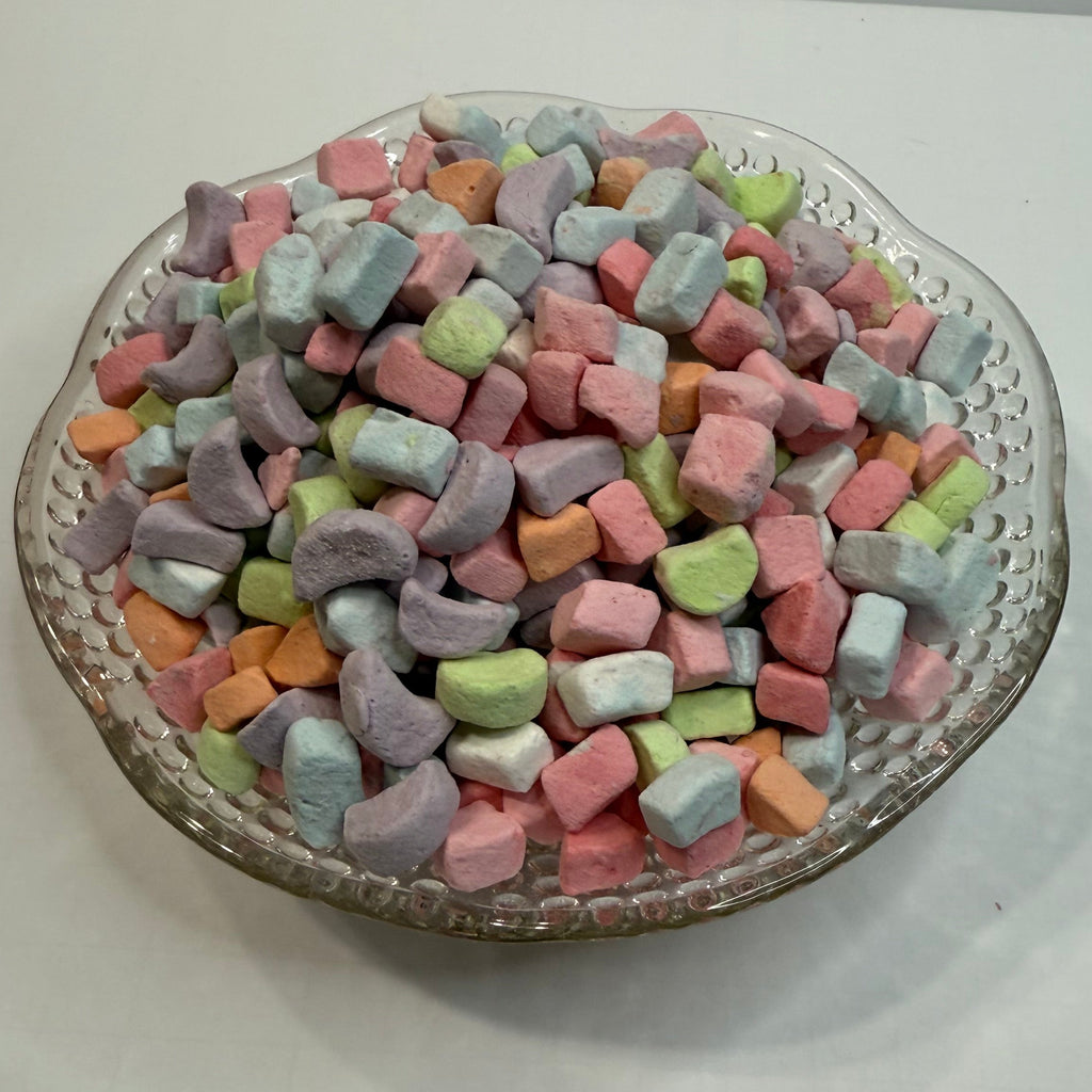 Decorative plate with colorful freeze dried marshmallows on a white background