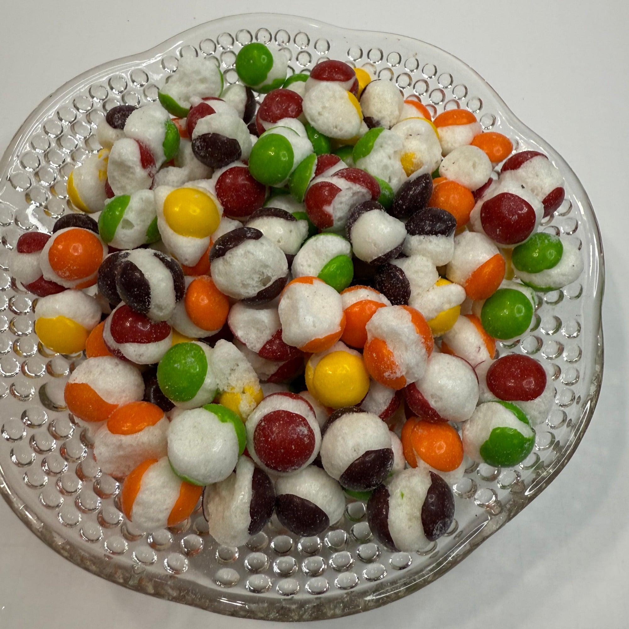 Freeze dried skittles on a decorative glass plate