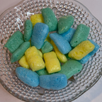 Freeze dried sour air headz on a textured glass plate