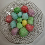 Freeze dried sour salt water taffy on a textured glass plate