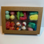 Box of assorted freeze dried snacks on a white background