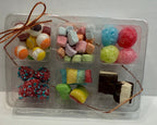 Assorted freeze dried candies & snacks in a clear plastic packaging on a white background